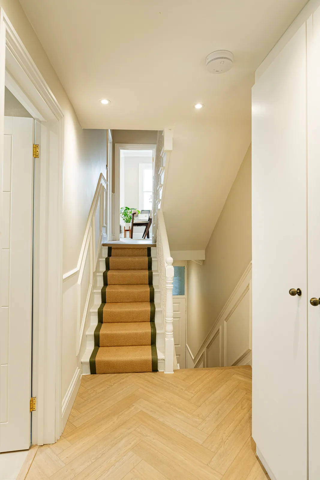 The stair, with a runner rising to the landing